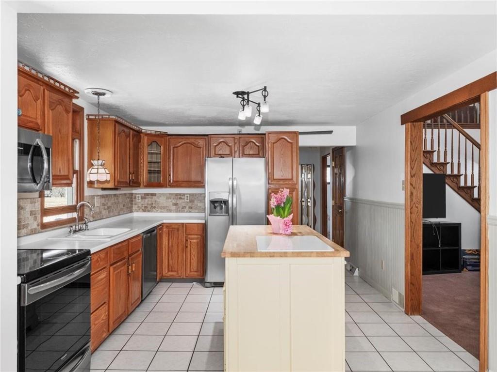 29 Profio Road McDonald, PA 15057 - Photo 9 of 44 a kitchen with a sink stove and cabinets