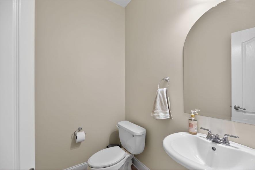 15 Fast Lane Ranburne, AL 36273 - Photo 26 of 51 a bathroom with a toilet sink and mirror