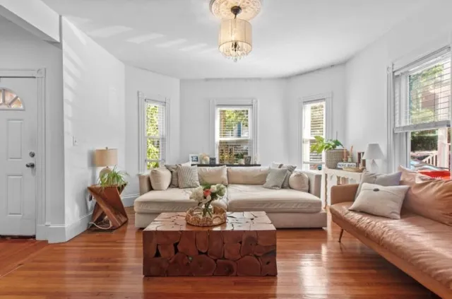 a living room with furniture or couch and a window