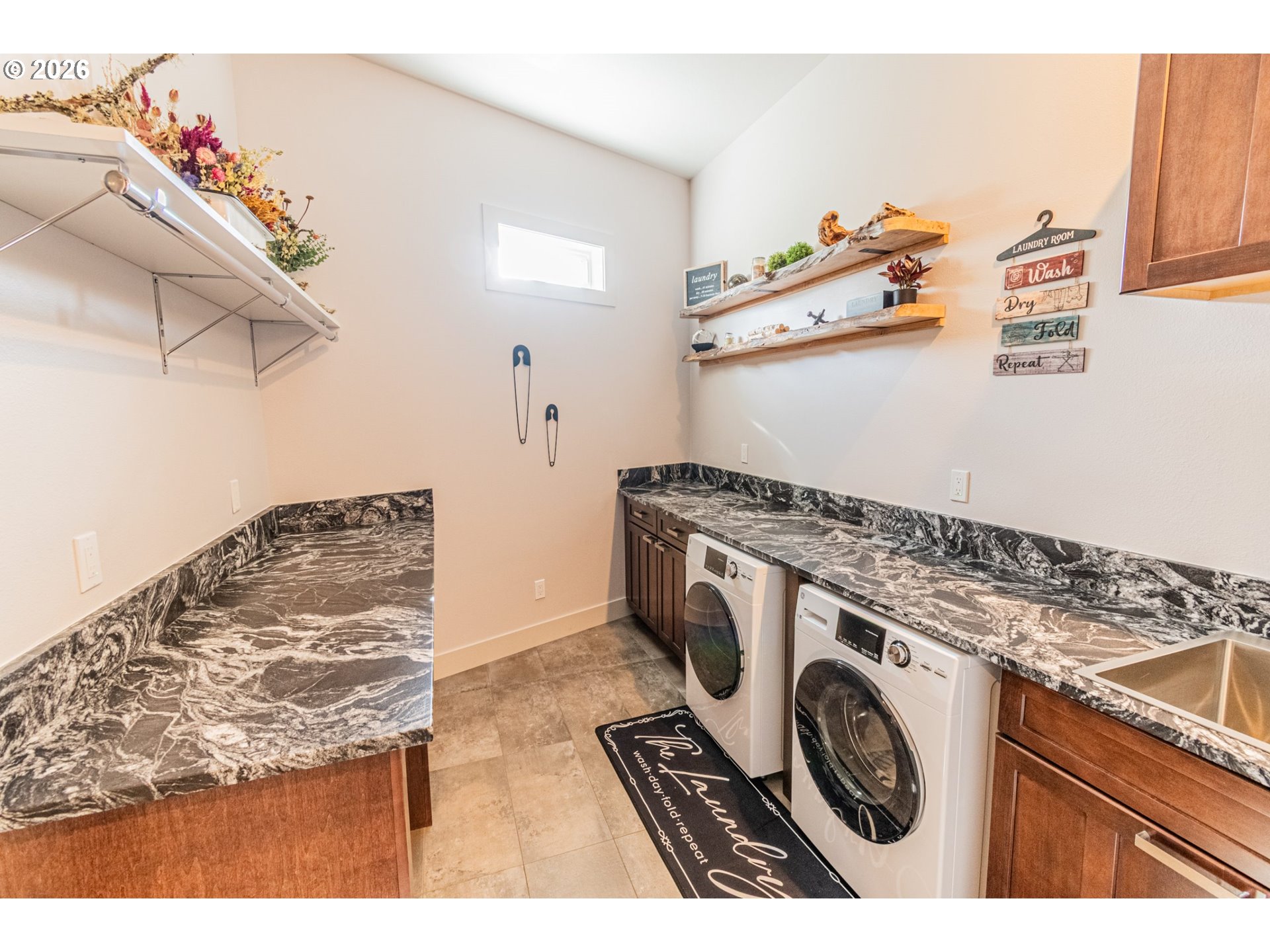 11 Fawn Ridge Lane Florence, OR 97439 - Photo 14 of 17 a utility room with sink dryer and washer