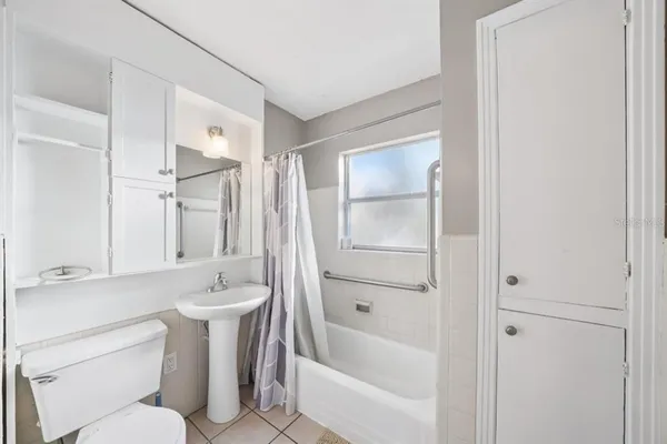 a bathroom with a toilet and a bathtub