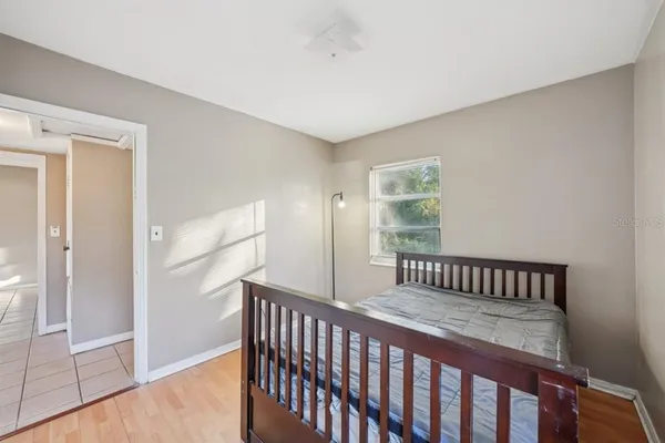 a bedroom with furniture and a window