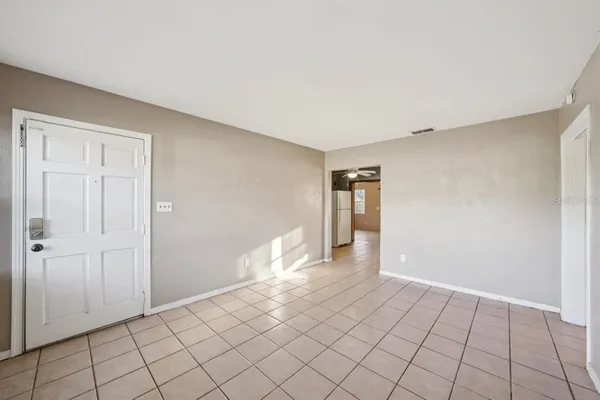a view of an empty room and window