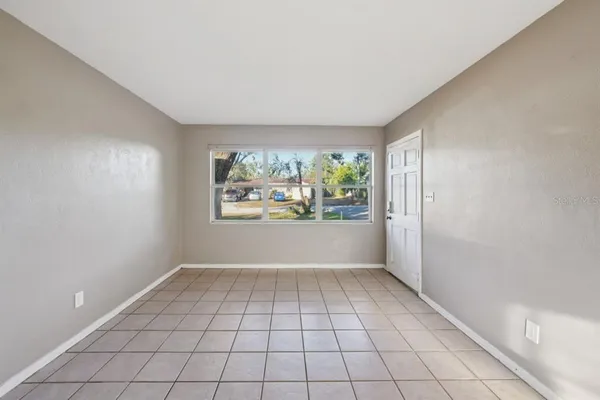 a view of an empty room with a window