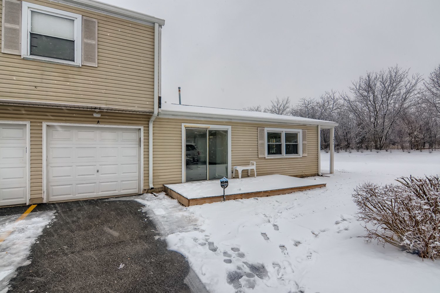 185 Rita Court, Unit A Bartlett, IL 60103 - Photo 11 of 11 a view of a house with a yard