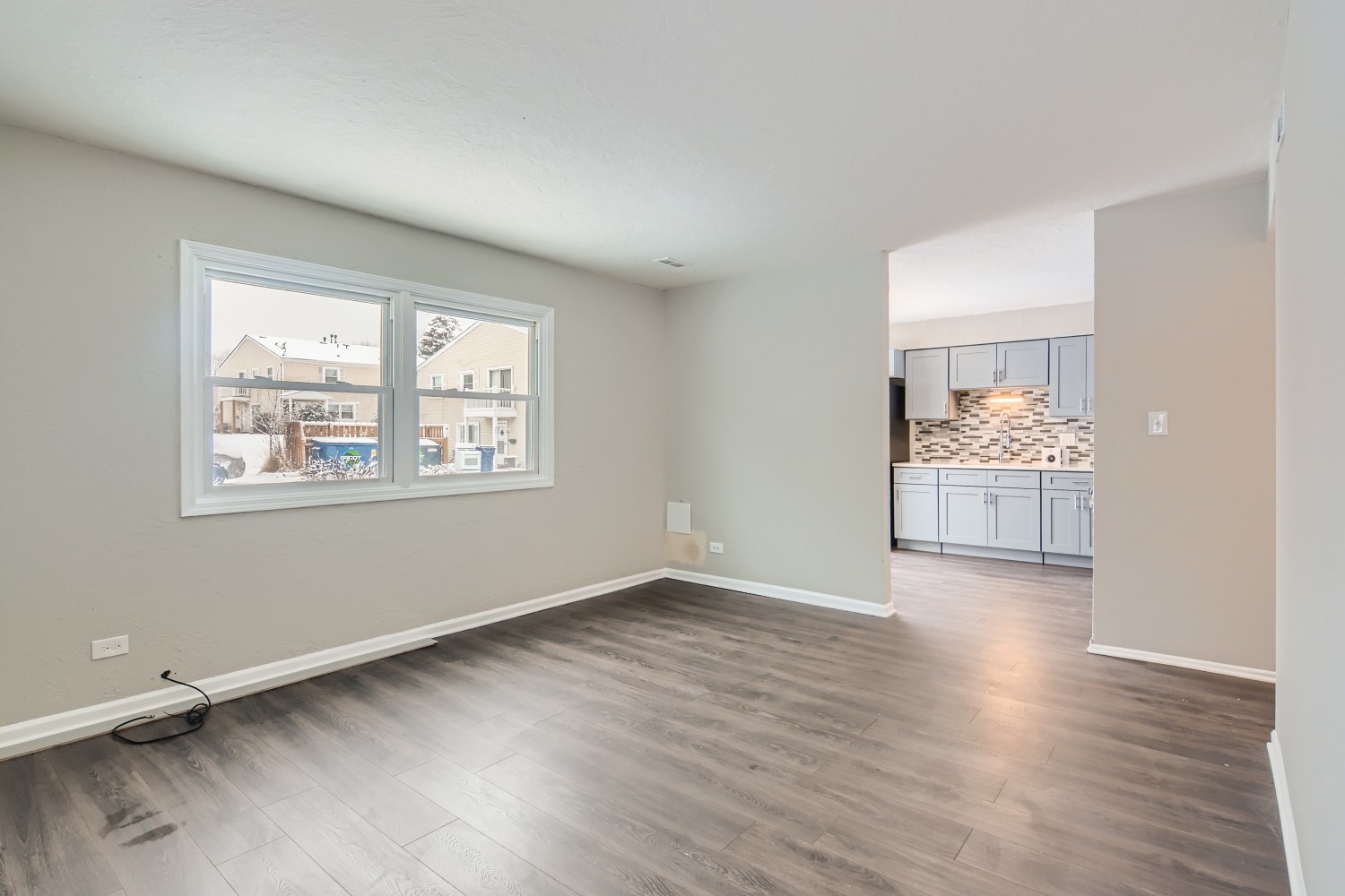 185 Rita Court, Unit A Bartlett, IL 60103 - Photo 3 of 11 an empty room with cabinet and wooden floor