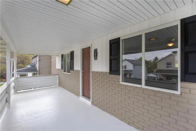 a view of a room with large windows