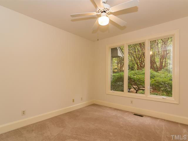 10108 Old Warden Road Raleigh, NC 27615 - Photo 11 of 25 The 1st floor guest bedrom offers new neutral carpet, freshly painted walls and triple windows! Bedroom