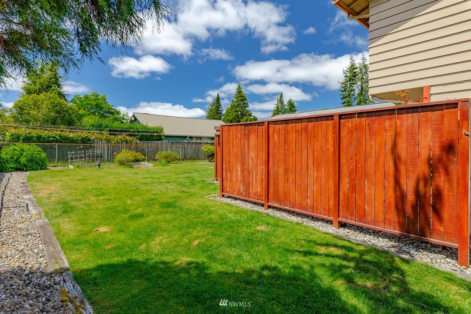 1209 Dundee Drive Cosmopolis, WA 98537 - Photo 14 of 36 a view of a backyard with plants and lake view