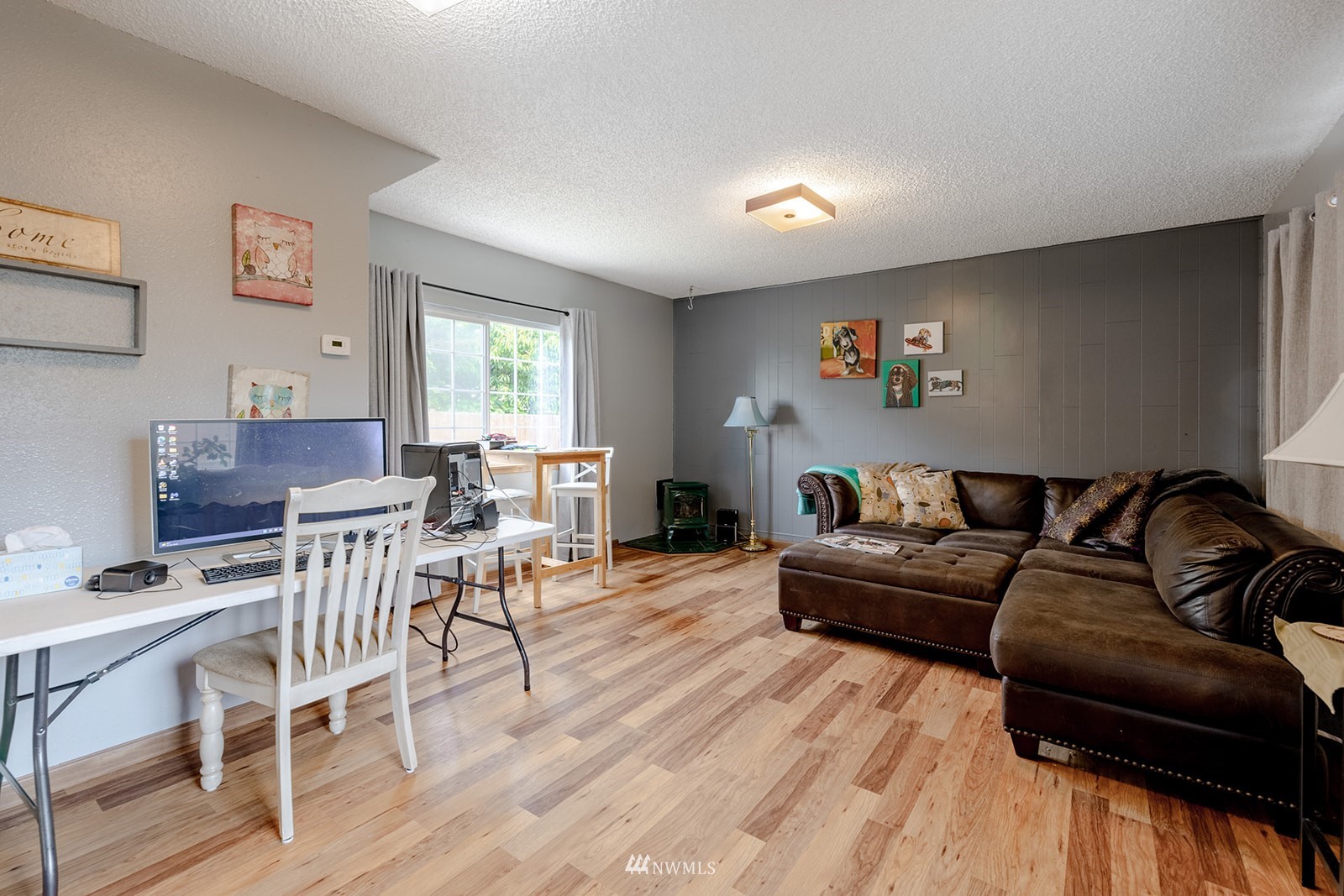 1209 Dundee Drive Cosmopolis, WA 98537 - Photo 29 of 36 a living room with furniture a dining table and a wooden floor