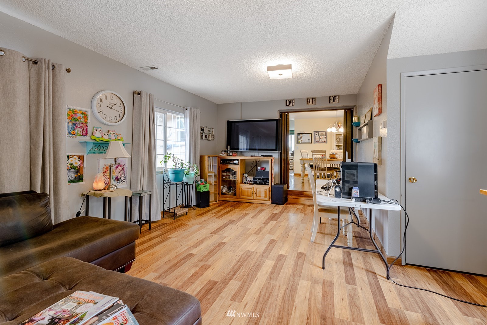 1209 Dundee Drive Cosmopolis, WA 98537 - Photo 30 of 36 a living room with furniture and a wooden floor