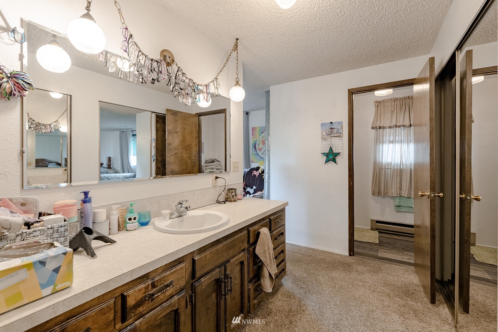 1209 Dundee Drive Cosmopolis, WA 98537 - Photo 33 of 36 a spacious bathroom with a sink double vanity and a mirror