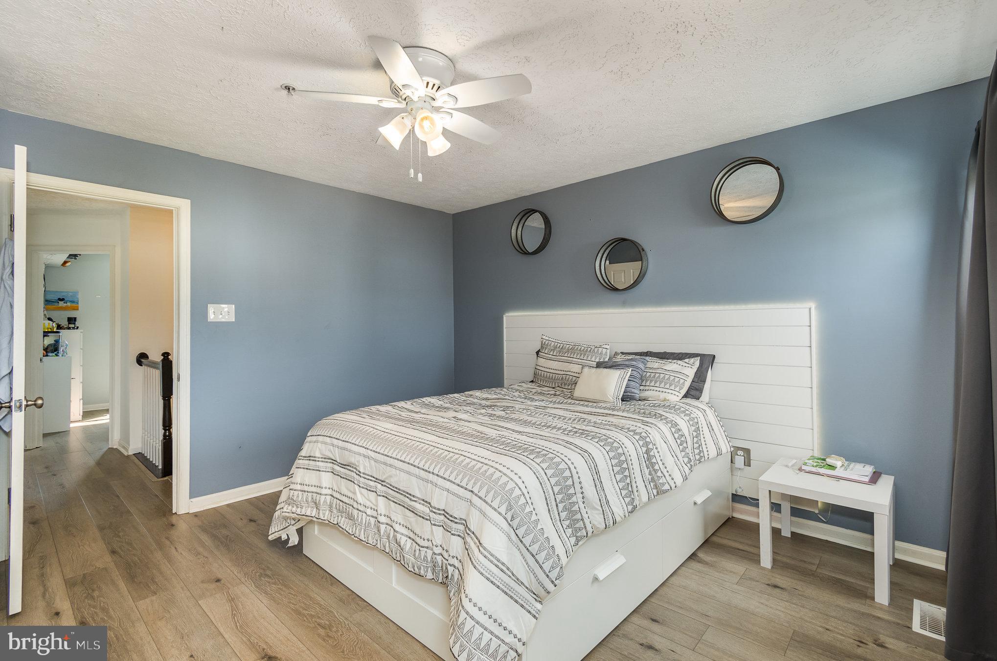 2114 Kyle Green Road Abingdon, MD 21009 - Photo 15 of 27 a bedroom with a bed and a chandelier