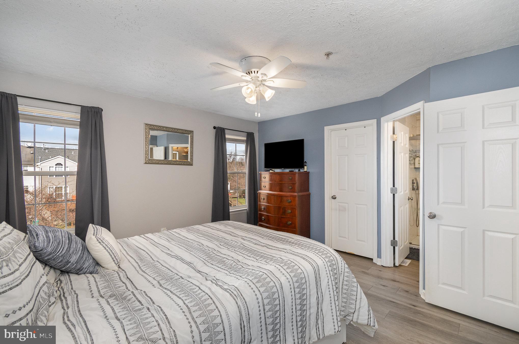 2114 Kyle Green Road Abingdon, MD 21009 - Photo 16 of 27 a bedroom with a bed and a chandelier