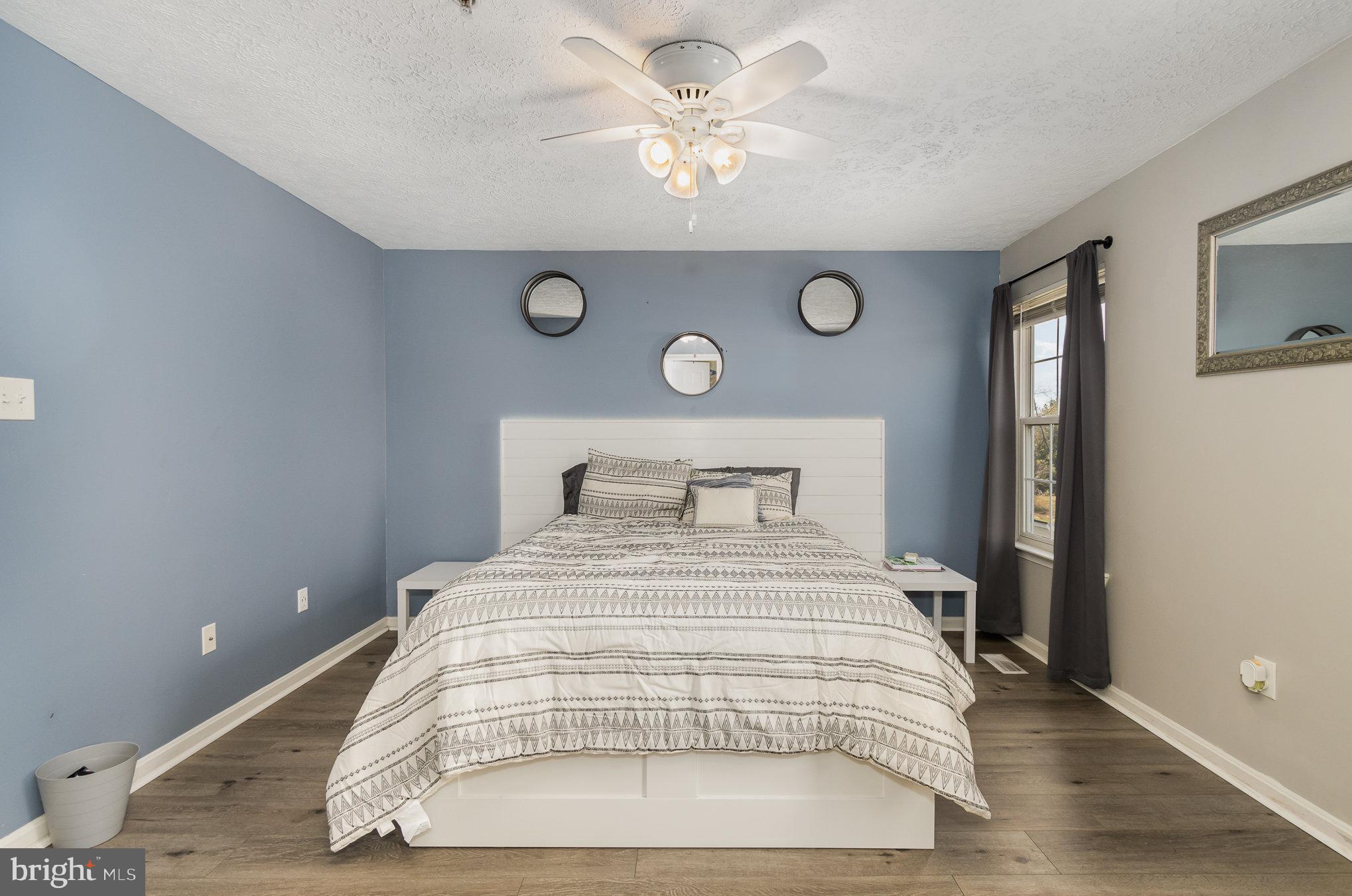 2114 Kyle Green Road Abingdon, MD 21009 - Photo 17 of 27 a bedroom with a bed and a chandelier