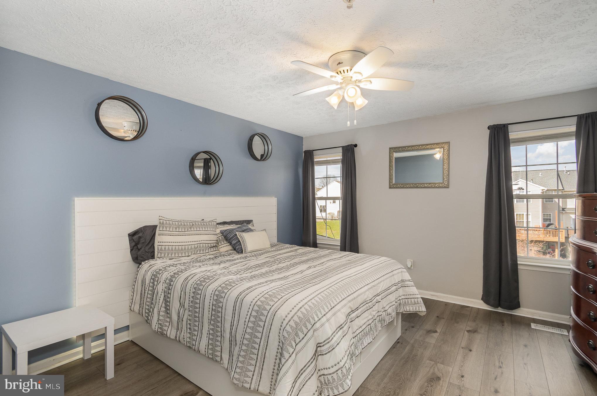 2114 Kyle Green Road Abingdon, MD 21009 - Photo 18 of 27 a bedroom with a large bed and a chandelier