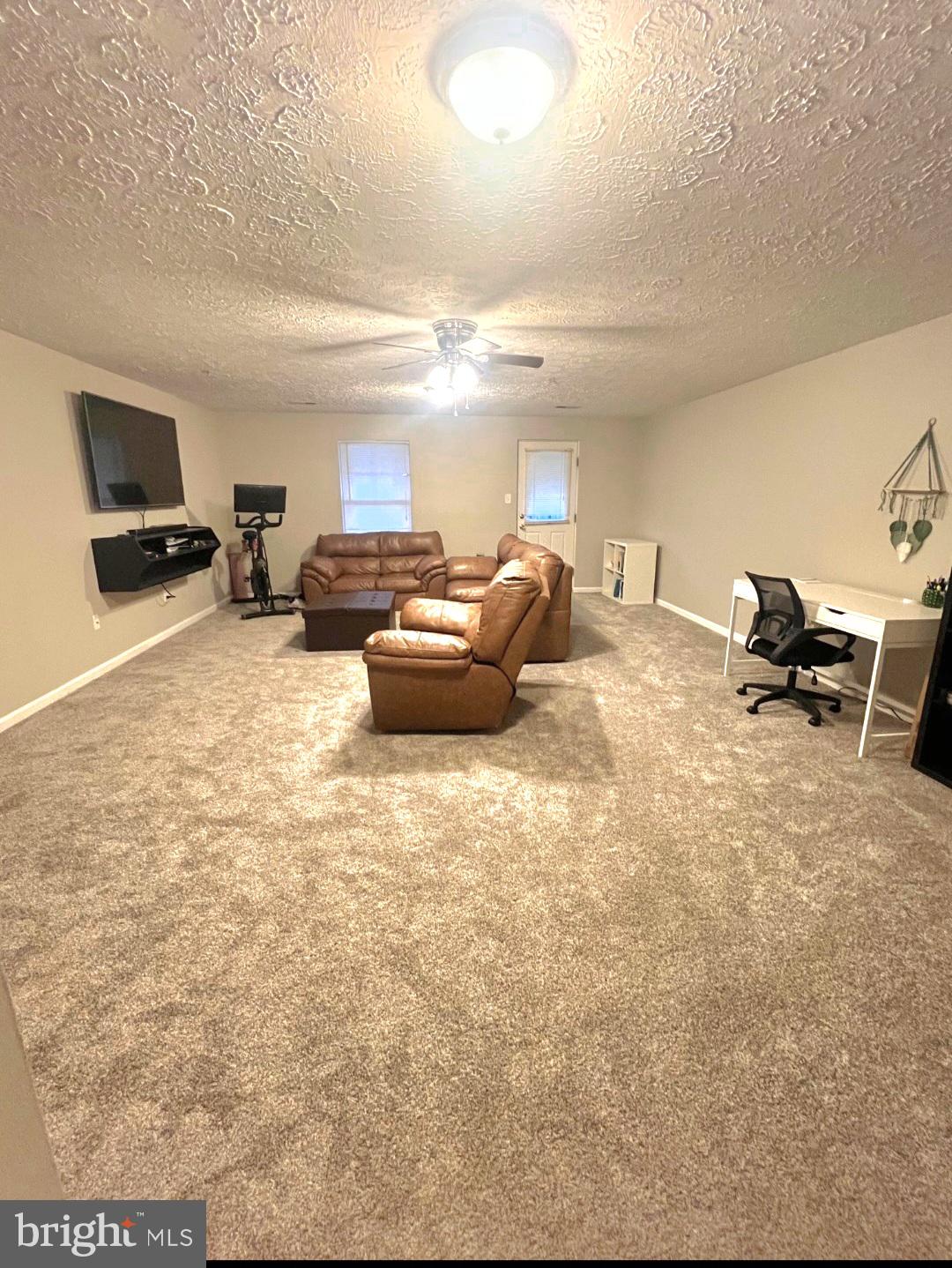 2114 Kyle Green Road Abingdon, MD 21009 - Photo 20 of 27 a living room with furniture and a flat screen tv