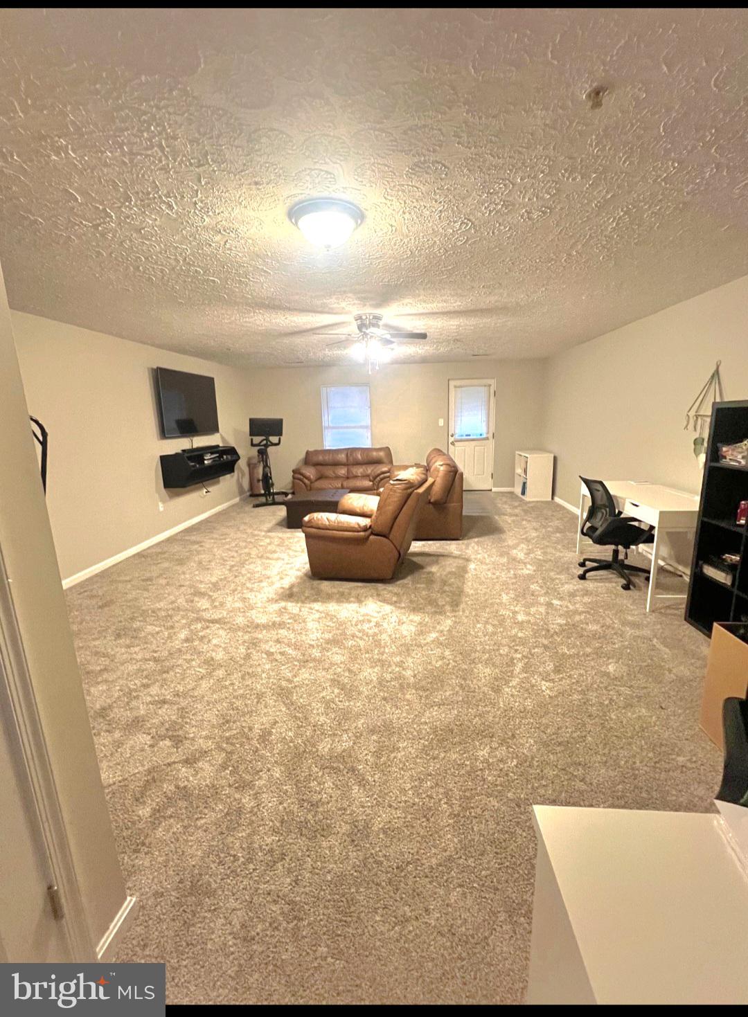 2114 Kyle Green Road Abingdon, MD 21009 - Photo 21 of 27 a living room with furniture and a flat screen tv