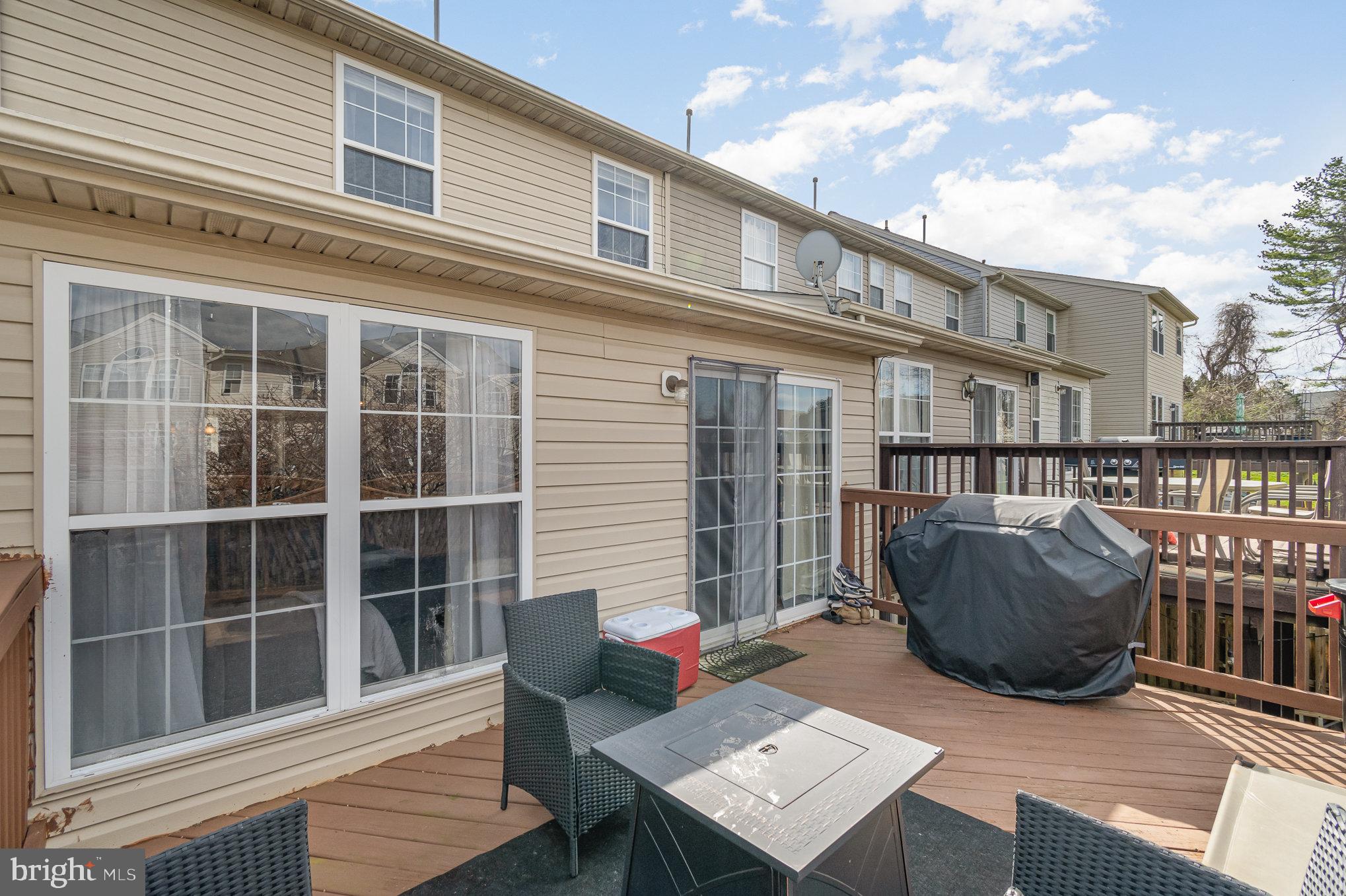 2114 Kyle Green Road Abingdon, MD 21009 - Photo 23 of 27 a view of a deck with couches floor to ceiling window with wooden floor