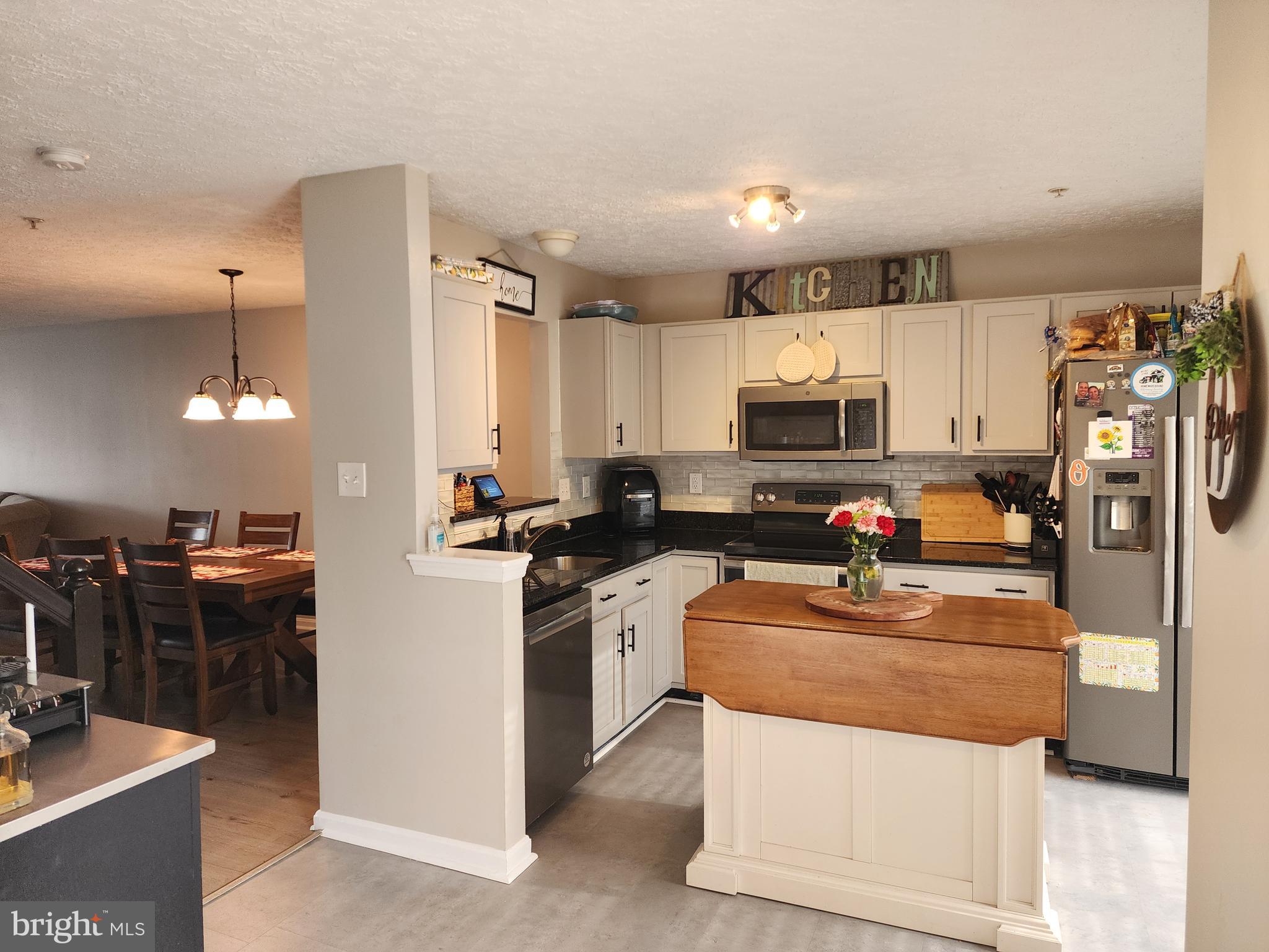 2114 Kyle Green Road Abingdon, MD 21009 - Photo 4 of 27 a kitchen with stainless steel appliances granite countertop a refrigerator stove microwave and sink