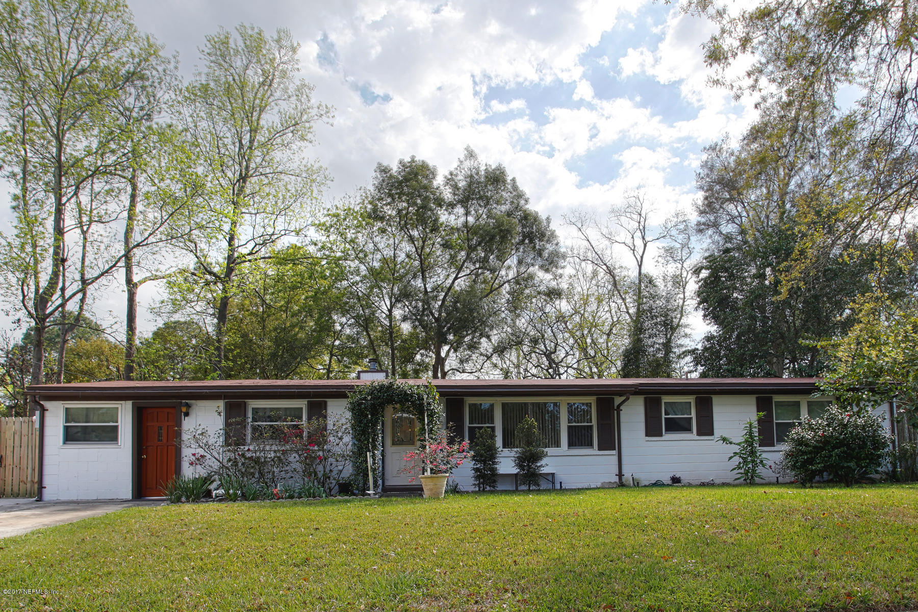 4956 Spring Glen Road Jacksonville, FL 32207 - Photo 1 of 23 front view of house with a yard