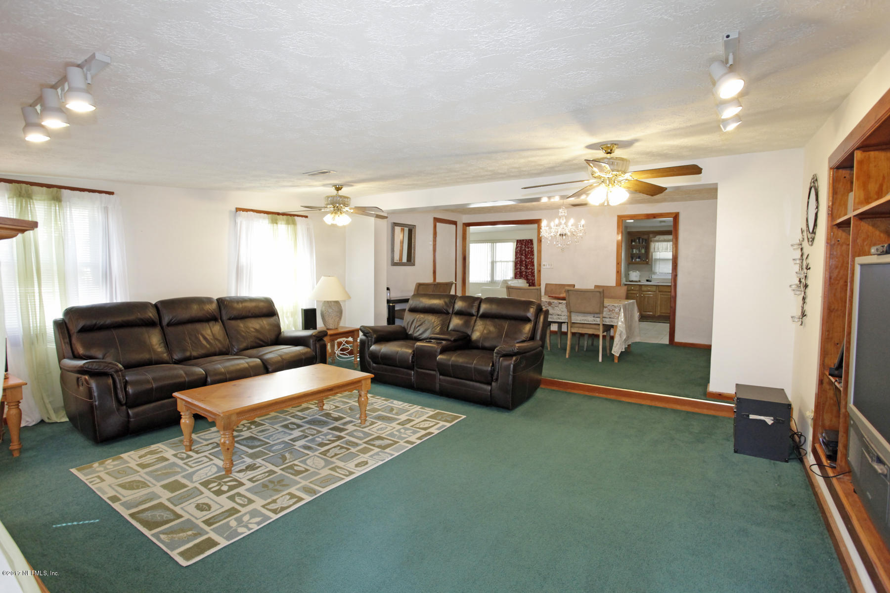 4956 Spring Glen Road Jacksonville, FL 32207 - Photo 10 of 23 a living room with furniture and a table