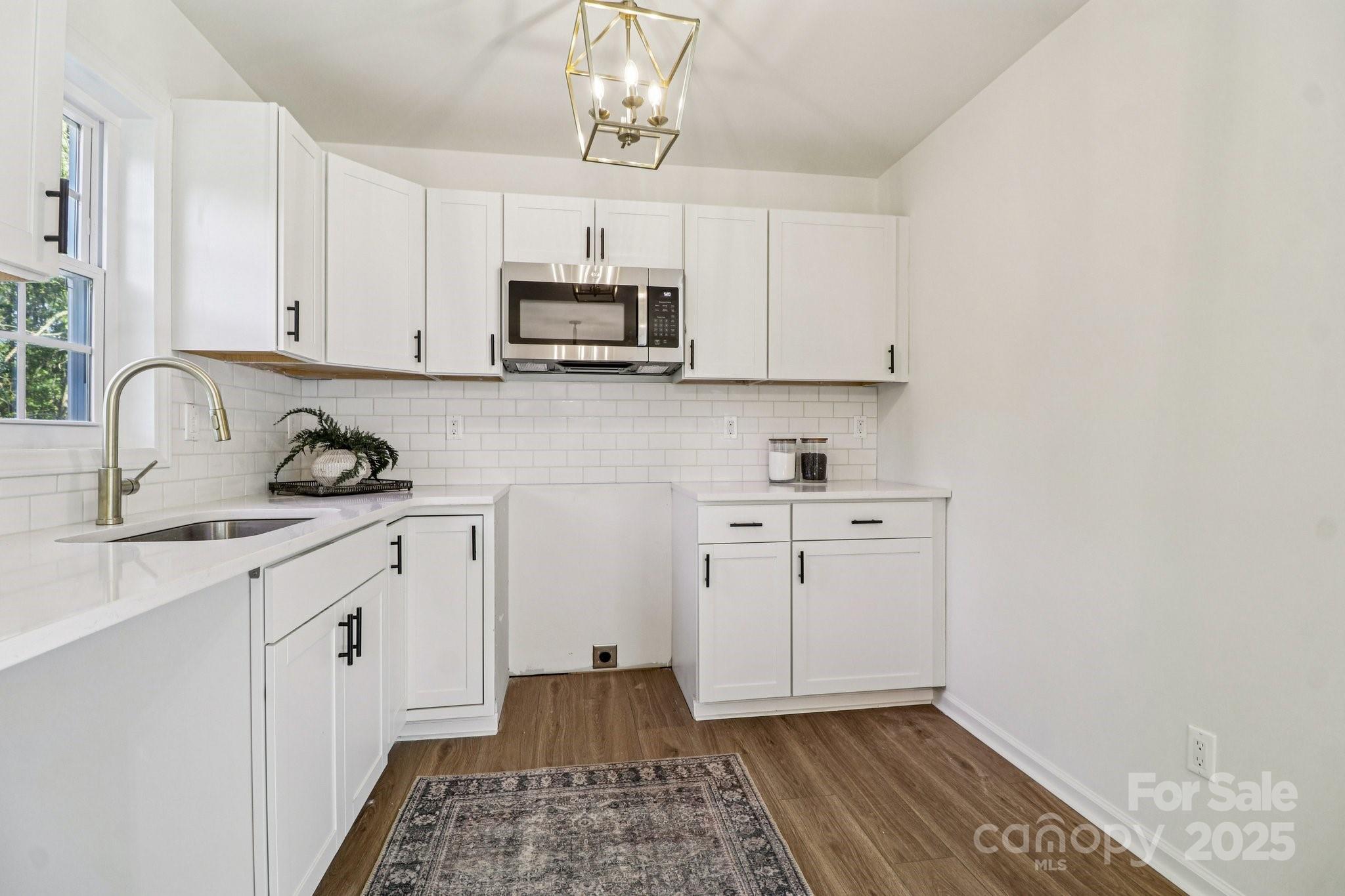 4409 Pleasant Road Lancaster, SC 29720 - Photo 3 of 34 a kitchen with cabinets appliances and a window