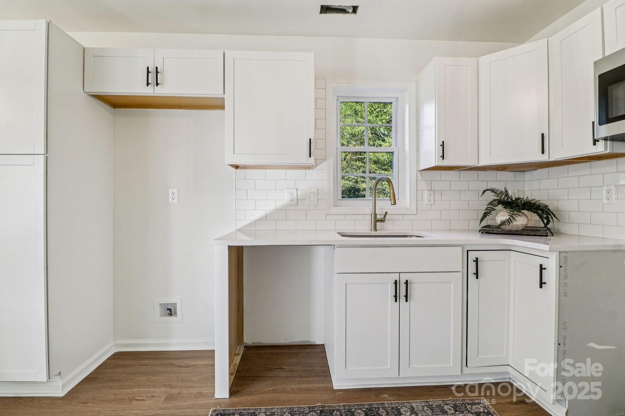 4409 Pleasant Road Lancaster, SC 29720 - Photo 4 of 34 a kitchen with stainless steel appliances granite countertop a sink and a white cabinets