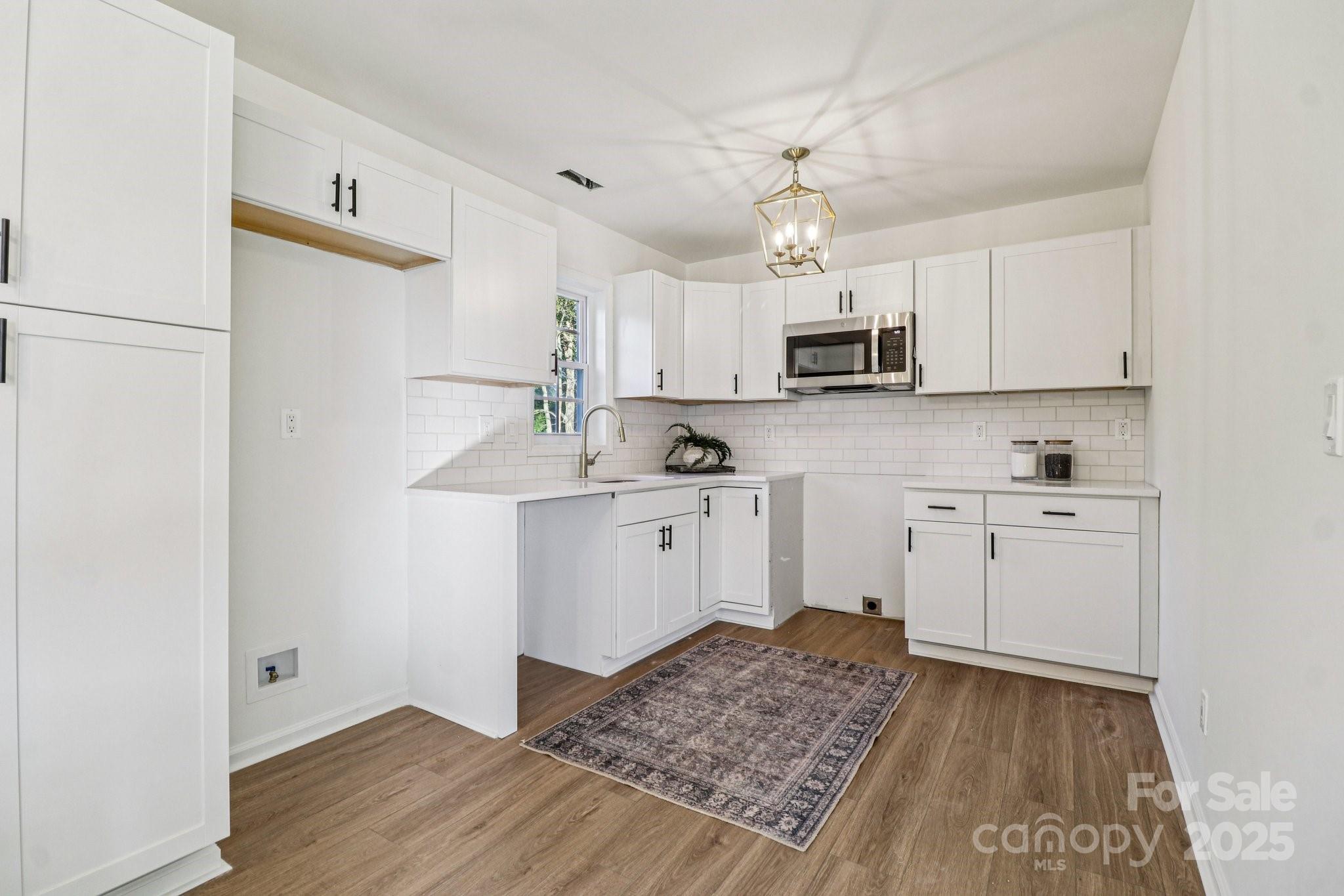 4409 Pleasant Road Lancaster, SC 29720 - Photo 5 of 34 a kitchen with a refrigerator and a stove top oven