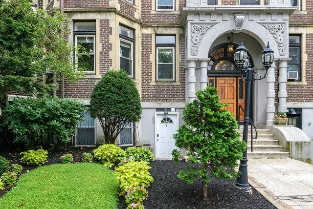 front view of a house with a garden