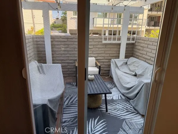 a view of an outdoor sitting area with furniture