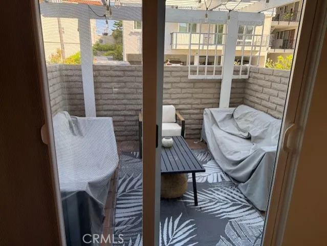 a view of an outdoor sitting area with furniture