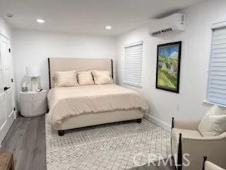 a bedroom with a bed and a couch