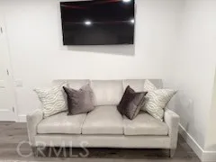 a living room with a couch and a flat screen tv