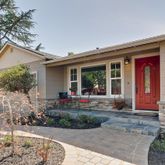 a view of a house with backyard and garden