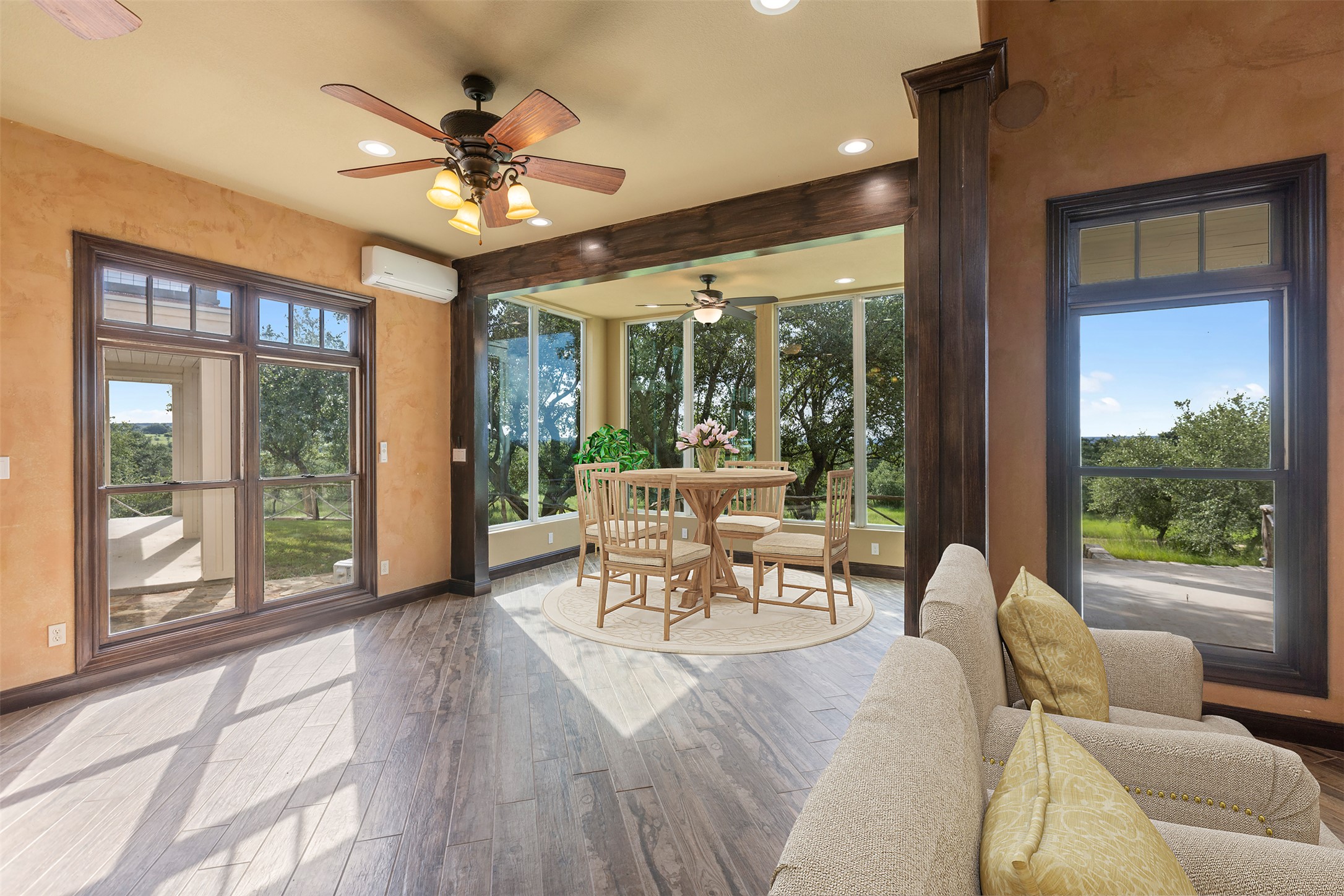 3149 Byrd Ranch Road Johnson City, TX 78636 - Photo 7 of 39 Sunroom / solarium with hardwood / wood-style flooring, recessed lighting, and an AC wall unit