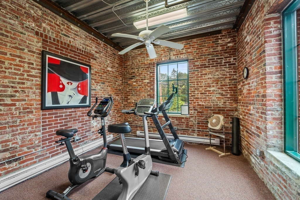 60 Merrimac Street, Unit 604 Amesbury, MA 01913 - Photo 32 of 42 a view of a room with gym equipment