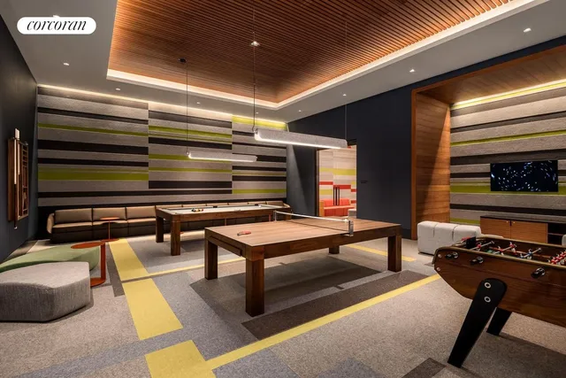 a reading room with furniture and a rug