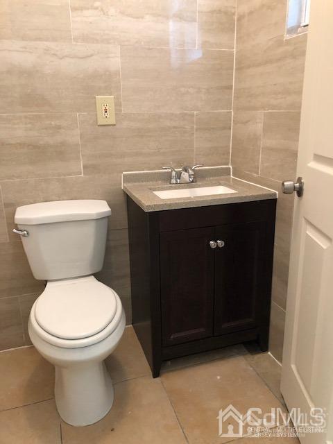 523 State Street Perth Amboy, NJ 08861 - Photo 8 of 22 a bathroom with a sink and a toilet