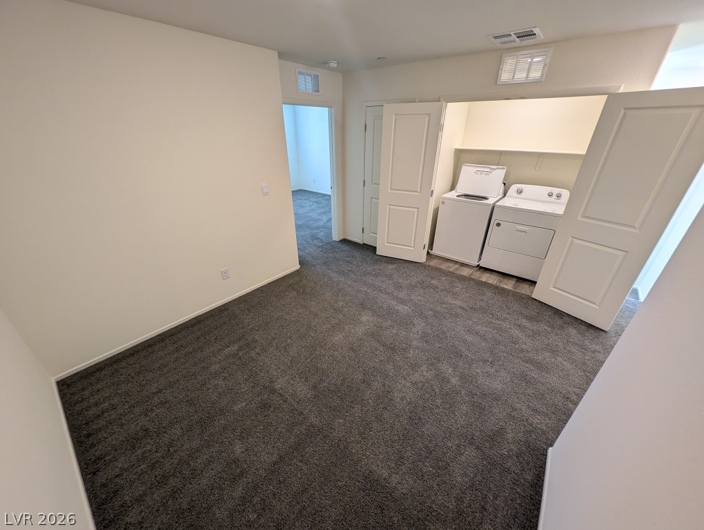 4820 Orchid Rdg Avenue Las Vegas, NV 89141 - Photo 15 of 27 Functional laundry facilities integrate seamlessly into this versatile living space, featuring plush carpeting.