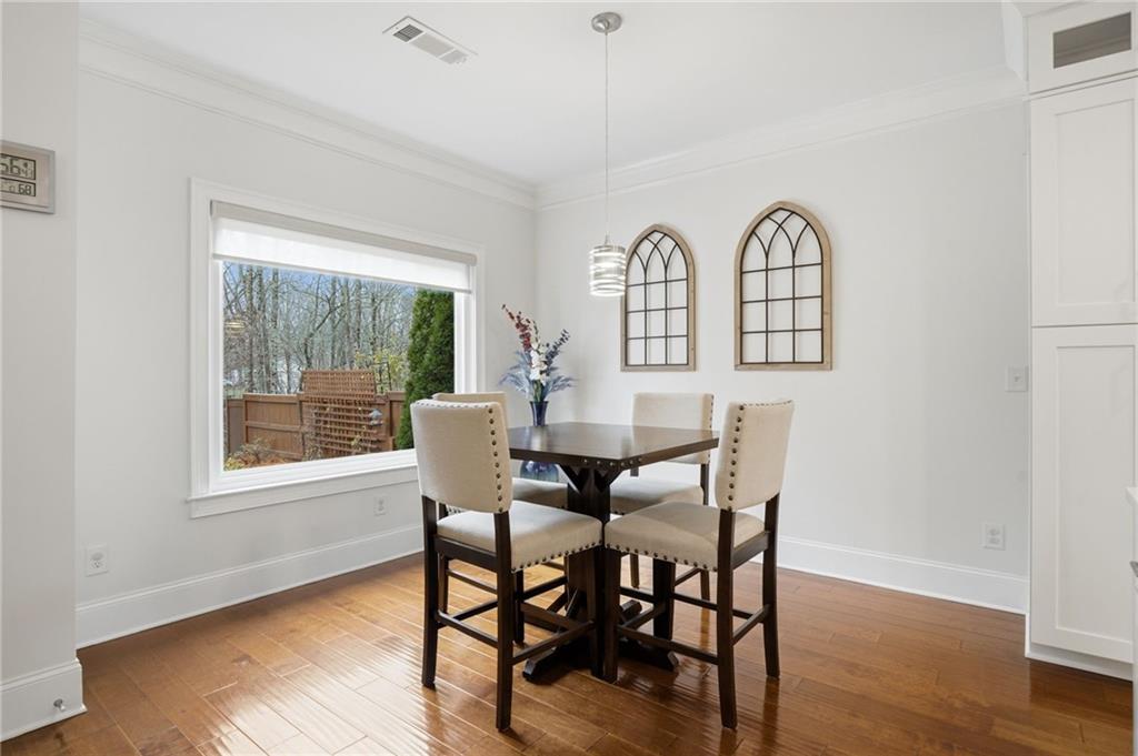 515 Sunset Street Canton, GA 30114 - Photo 12 of 64 a view of a a dining room with furniture window and wooden floor