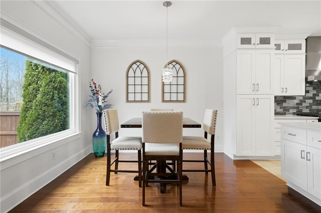 515 Sunset Street Canton, GA 30114 - Photo 13 of 64 a view of a dining room with furniture window and wooden floor