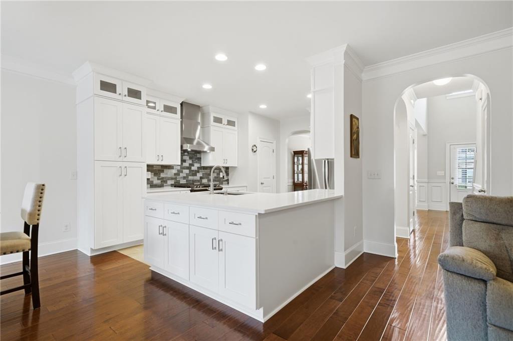 515 Sunset Street Canton, GA 30114 - Photo 16 of 64 a kitchen with stainless steel appliances a refrigerator and wooden floor
