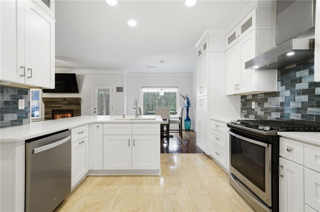 515 Sunset Street Canton, GA 30114 - Photo 20 of 64 a kitchen with granite countertop a sink stainless steel appliances and cabinets