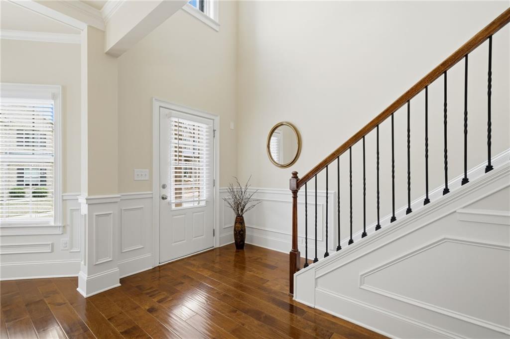 515 Sunset Street Canton, GA 30114 - Photo 2 of 64 a view of a hallway with wooden floor and windows