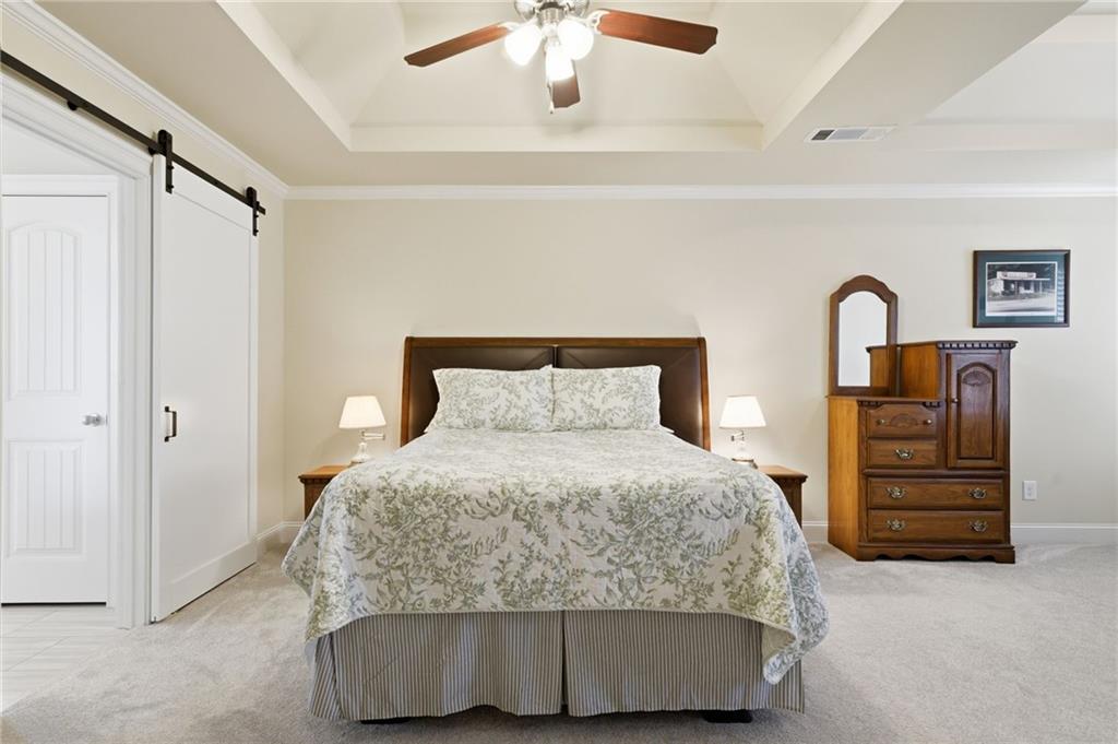 515 Sunset Street Canton, GA 30114 - Photo 24 of 64 a bedroom with a bed and dresser