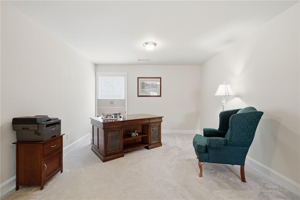 515 Sunset Street Canton, GA 30114 - Photo 29 of 64 a living room with furniture and a chair