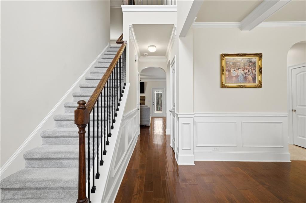 515 Sunset Street Canton, GA 30114 - Photo 3 of 64 a view of a hallway with wooden floor and staircase