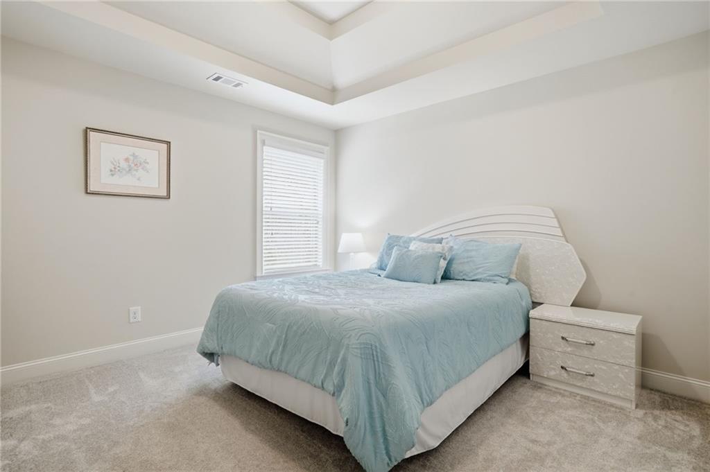 515 Sunset Street Canton, GA 30114 - Photo 31 of 64 a bedroom with a bed and a window