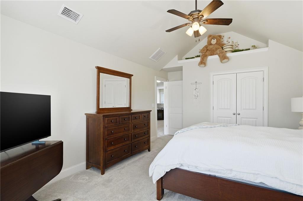 515 Sunset Street Canton, GA 30114 - Photo 34 of 64 a bedroom with a bed and a flat screen tv